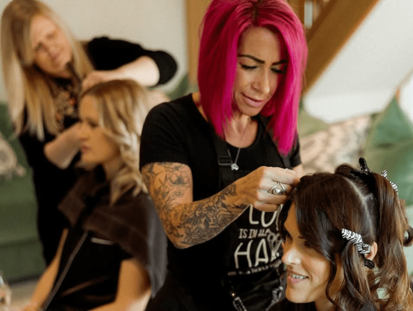 Belle and stylist cutting and styling clients’ hair at The Dolls House Hair & Beauty Boutique in Eastbourne – expert, personalised salon service in action.