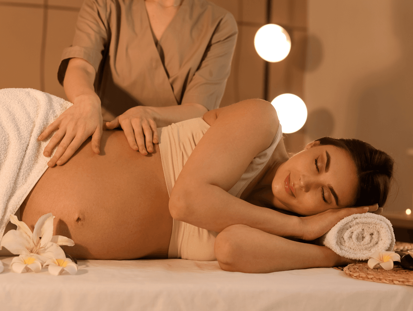 a woman receiving a pregnancy massage in Eastbourne