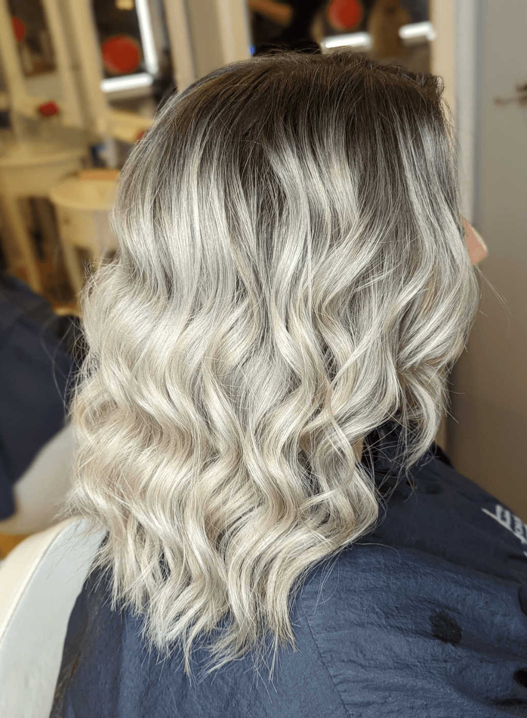 Soft root melt blonde hair colour at The Dolls House Hair & Beauty Boutique in Eastbourne – expertly blended colour with a natural, seamless finish.
